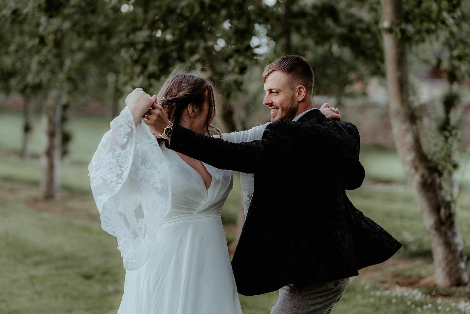 couple dancing in the orchard